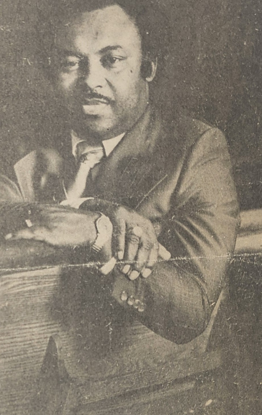 Man looking over church pew