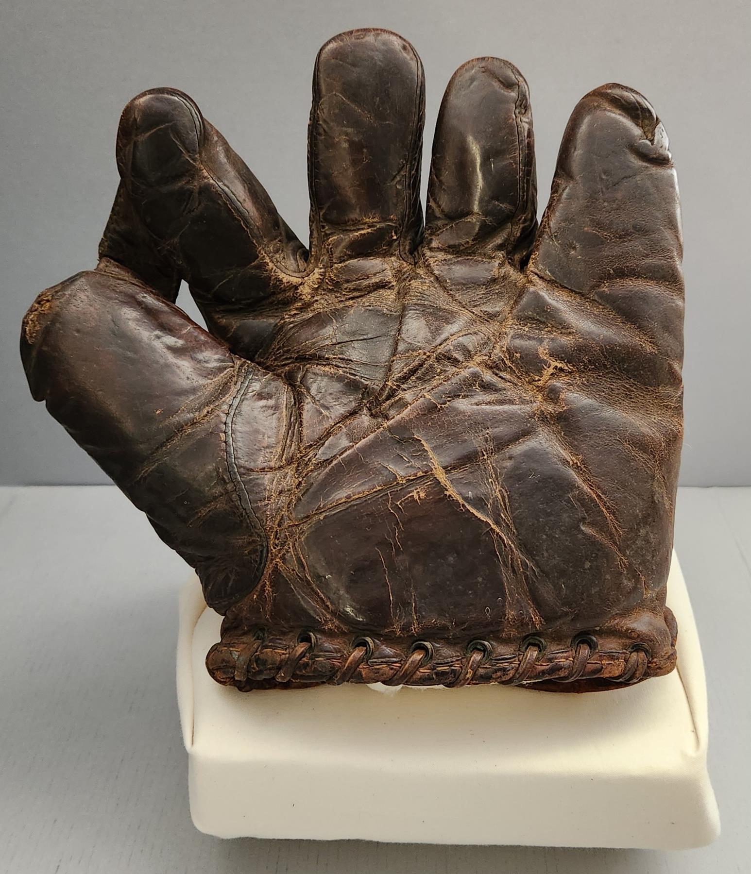 Leather baseball mitt Glove shaped with four fingers and thumb