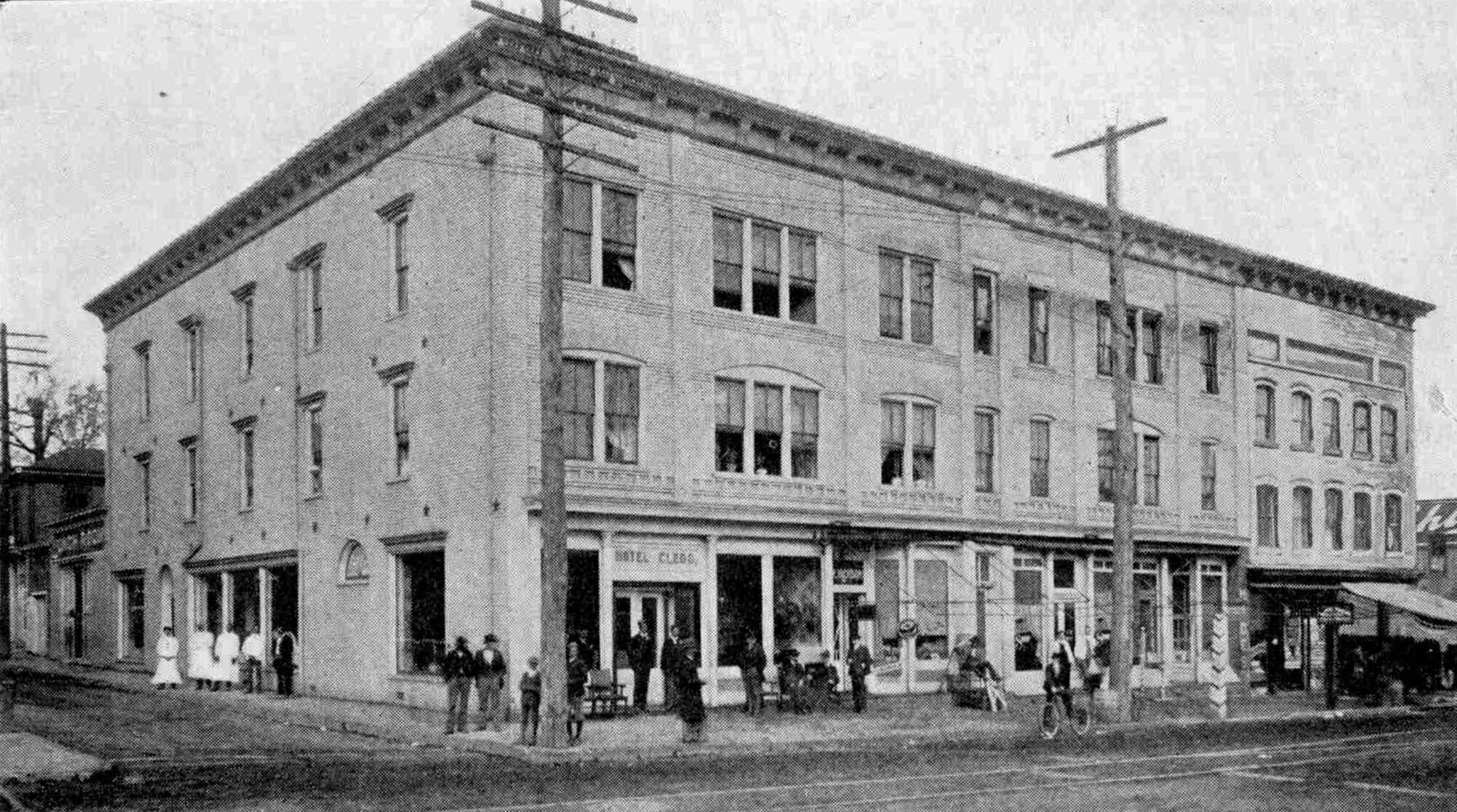Black and white image of white brick three-story hotel on streetfront in Greensboro 1903.